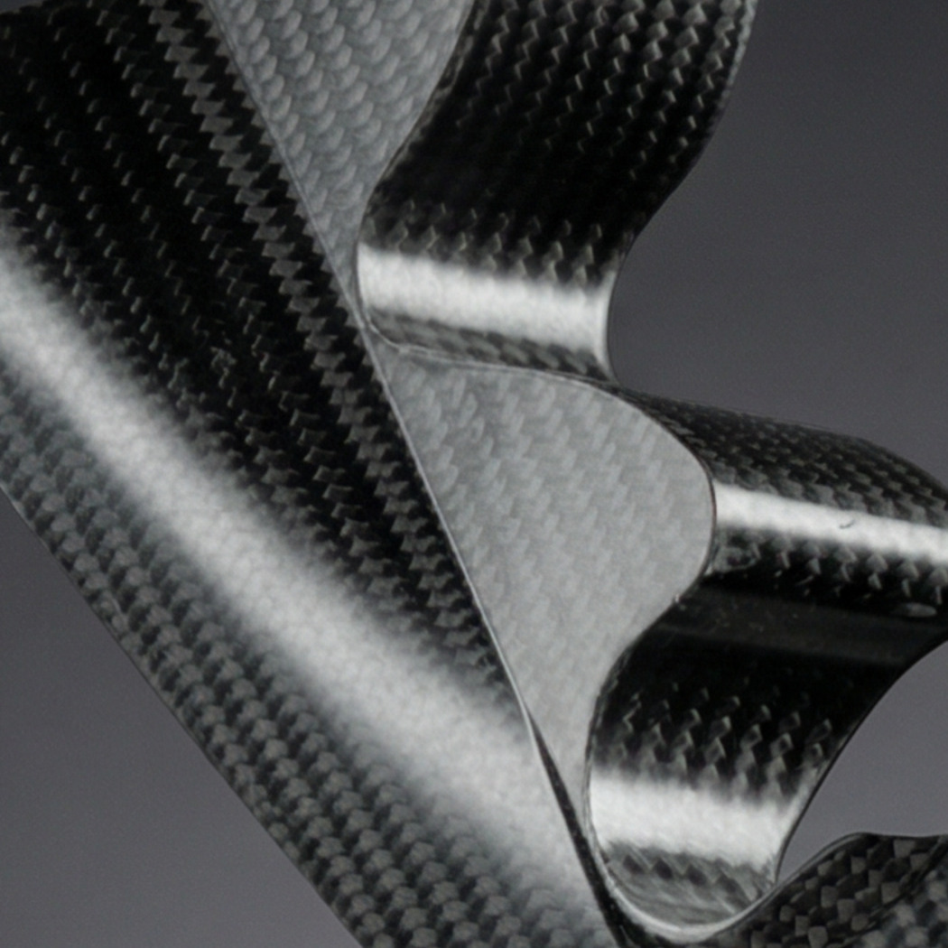 Ex-Core carbon fibre composite part on black background